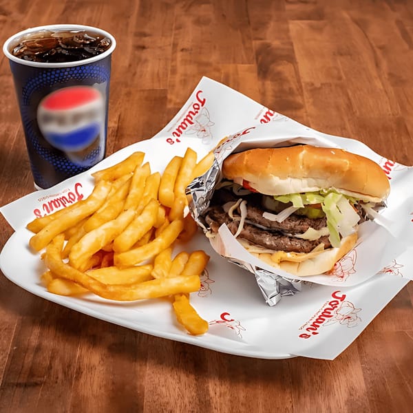 Jordan's double cheeseburger with fries and a soda on a white tray.