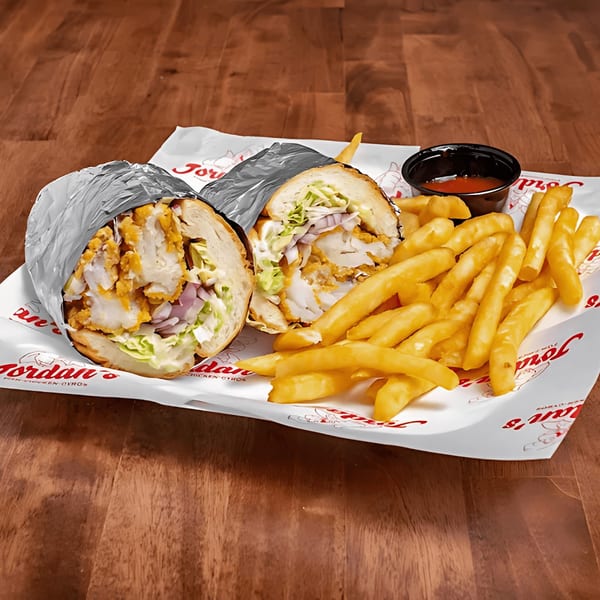 Jordan's Fish and Chicken fried fish sandwich, fries, and sauce on branded paper.